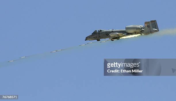 An A-10 Thunderbolt fires rockets during a U.S. Air Force firepower demonstration at the Nevada Test and Training Range September 14, 2007 near...