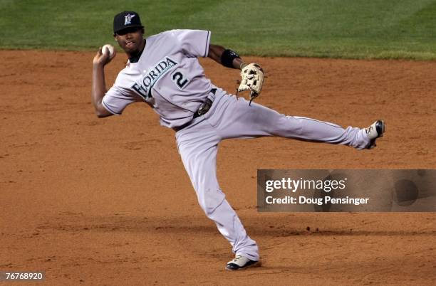 Shortstop Hanley Ramirez of the Florida Marlins makes a barehanded stop and throws out Matt Holliday of the Colorado Rockies in the fifth inning at...