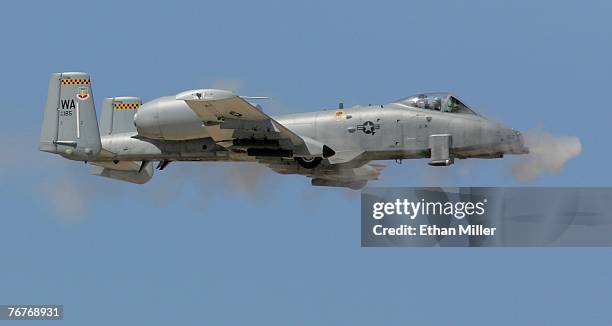 An A-10 Thuderbolt fires its 30 mm Gatling gun during a U.S. Air Force firepower demonstration at the Nevada Test and Training Range September 14,...
