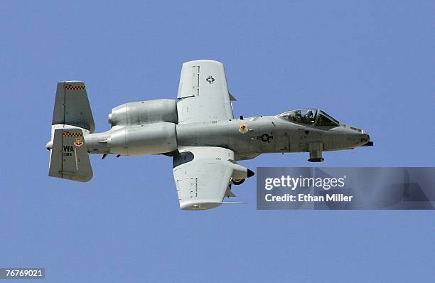 An A-10 Thunderbolt flies by during a U.S. Air Force firepower demonstration at the Nevada Test and Training Range September 14, 2007 near Indian...