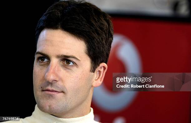 Jamie Whincup of Team Vodafone sits in his pit garage prior to the qualifying session for the Sandown 500 which is Round 9 of the V8 Supercars...
