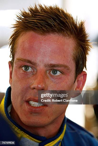 James Courtney of Jeld-Wen Motorsport sits in his pit garage during the qualifying session for the Sandown 500 which is Round 9 of the V8 Supercars...