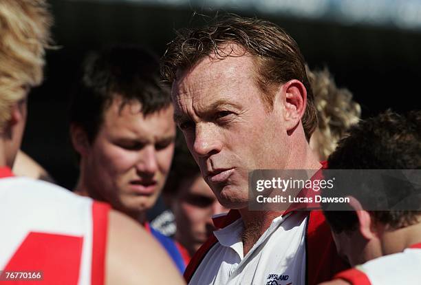 Coach Adrian Hickmott of Gippsland Power talks to his players during the 1st quarter break of the TAC Cup first semi final match between Gippsland...