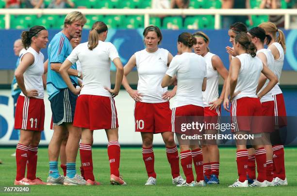 Denmark's assistant coach Nielsen Per gives instructions to his players before their 2007 FIFA Women's World Cup Football match tournament Group D at...