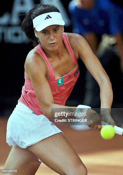 Sorana Cirstea of Romania returns the ball against Daniela Hantucchova of Slovakia during their semi final match of the Bali International tennis...