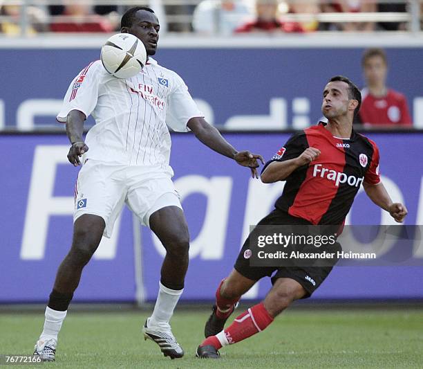 Markus Weissenberger of Frankfurt competes with Timothee Atouba of Hamburg during the Bundesliga match between Eintracht Frankfurt and Hamburger SV...