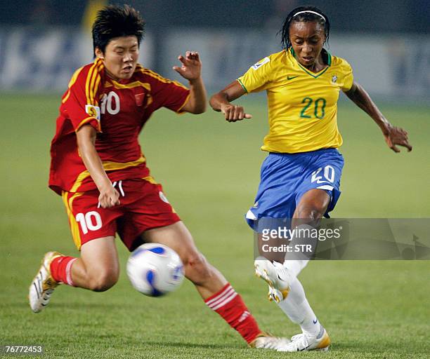 China's Forward Ma Xiaoxu fights for the ball with Brazil's Midfielder Ester Aparecida Dos Santos during their 2007 FIFA Women's World Cup Football...