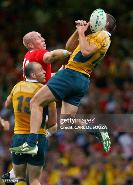 Australia's fullback Chris Latham misses the ball as Wales's centre Tom Shanklin tries to stop him during the rugby union World Cup group B match...