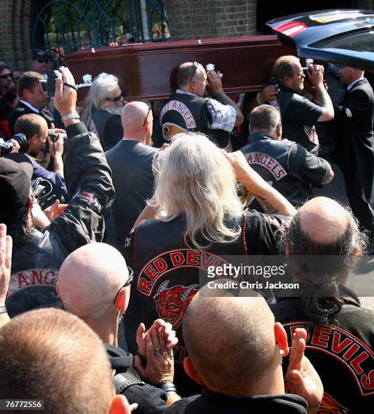 Hells Angel mourners clap as the coffin of Gerard Tobin is carried in ...