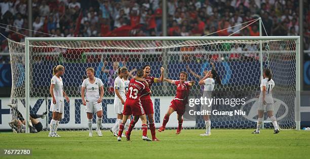 Katrine Pedersen of Denmark celebrates after she scored a point during the Group D Womens World Cup match between Denmark and New Zealand at Wuhan...