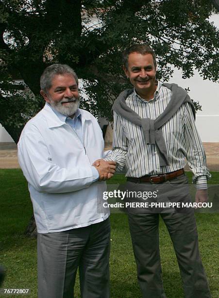 Brazilian President Luiz Inacio Lula da Silva shakes hands with Spanish Prime Minister Jose luis Rodriguez Zapatero at the Quintos de Mora ranch near...