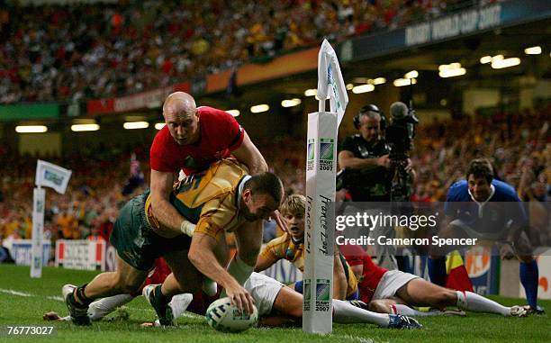 Chris Latham of Australia scores a try during the Rugby World Cup 2007 Pool B match between Wales and Australia at the Millenium Stadium on September...