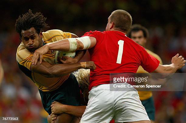 Lote Tuqiri of Australia is challenged by Gethin Jenkins of Wales during the Rugby World Cup 2007 Pool B match between Wales and Australia at the...