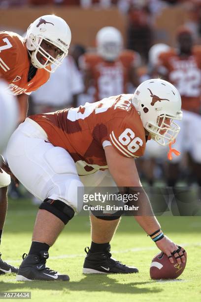 Center Buck Burnette of the Texas Longhorns waits to snap the ball to quarterback John Chiles during their game against the TCU Horned Frogs on...