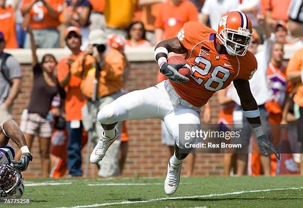 Running back C.J. Spiller of the Clemson Tigers dives for yardage against the Furman Paladins at Memorial Stadium on September 15, 2007 in Clemson,...