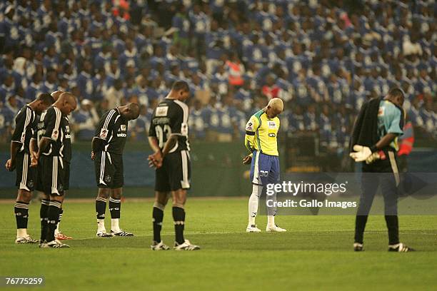 Players from both teams give a minutes silence for recently deceased player Gift Leremi prior to the SAA Supa 8 Final match between the Mamelodi...