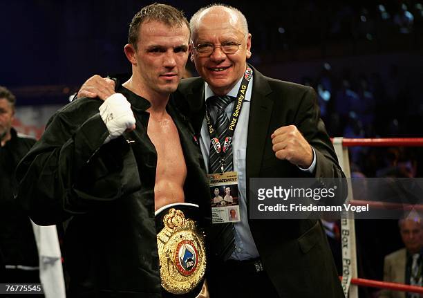 Juergen Braehmer of Germany and Promoter Klaus Peter Kohl celebrates after winning his WBO Super Middleweight Inter-Continental Championship fight...