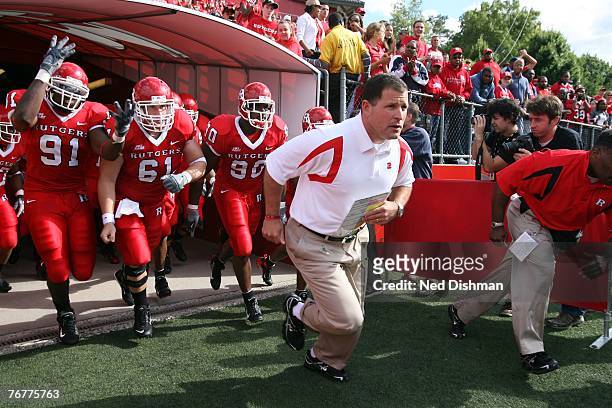 Head coach Greg Schiano of the Rutgers University Scarlett Knights leads his team out of the tunnel against the Norfolk State Spartans at Rutgers...