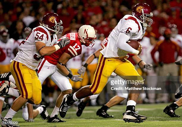 Malcom Smith of the USC Trojans carries the ball after a Chauncey Washington fumble on a kickoff against the Nebraska Cornhuskers on September 15,...