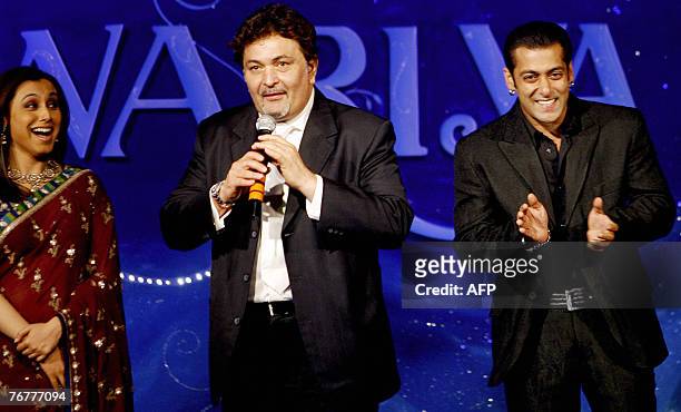 Indian Bollywood actors Rani Mukherjee and Salman Khan react as Rishi Kapoor speaks during the music release of the film "Saawariya" in Mumbai, 15...