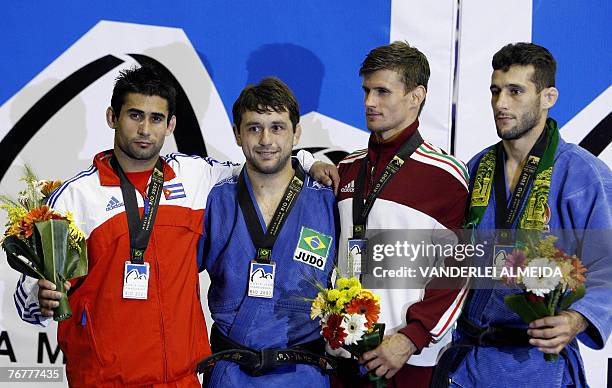 Cuban Yordanis Arencibia , Brazilian Joao Derly , Hungary's Miklos Ungvari and Iranian Arash Miresmaeili celebrate on the podium after the men's...