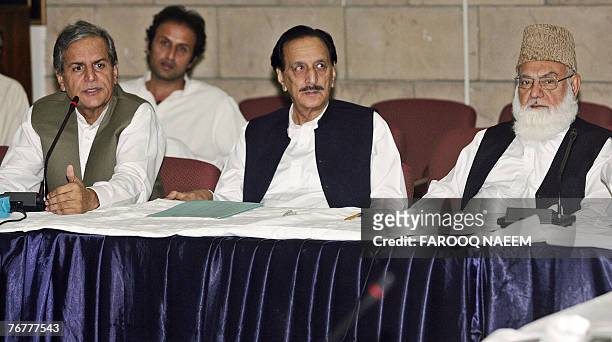 Leaders of the All Parties Democratic Movement Qazi Hussain Ahmed from the hardline Muttahida Majlis-e-Amal , Raja Zafar-ul-Haq and Javed Hashmi from...