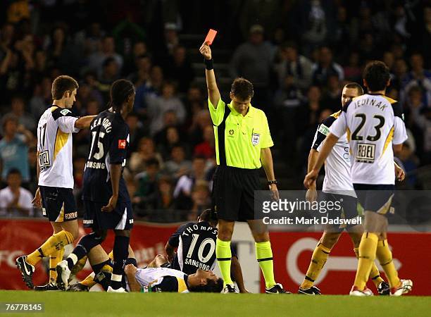 Tony Vidmar of the Mariners is shown the red card by the referee during the round four A-League match between the Melbourne Victory and the Central...