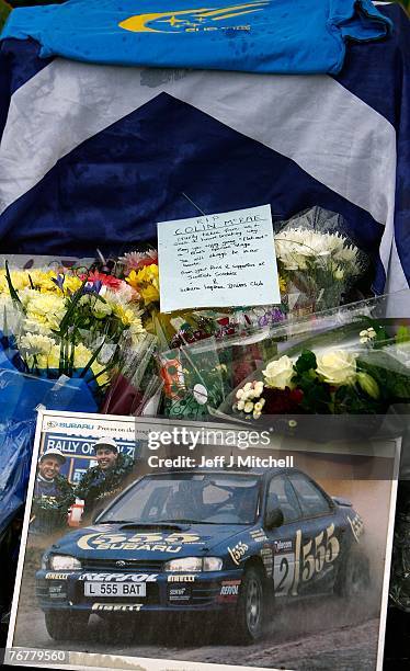 The Scottish Subaru Imprezza owners club leave flowers near the home of Colin McCrae in Lanark, where a twin squirrel helicopter crashed yesterday...