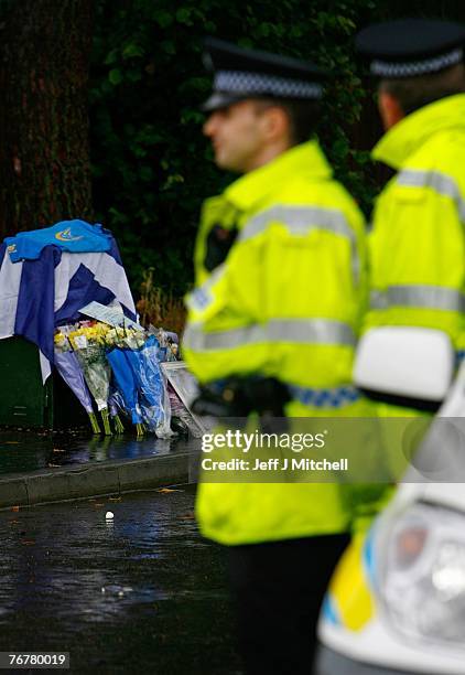 The Scottish Subaru Imprezza owners club leave flowers near the home of Colin McCrae in Lanark where a twin squirrel helicopter has crashed yesterday...