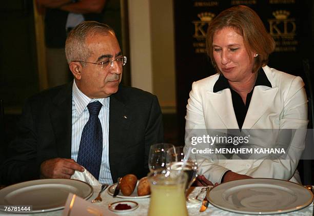 Israeli Foreign Minister Tzipi Livni talks with Palestinian Prime Minister Salam Fayyad during a Ramadan dinner or 'iftar' hosted by Livni for Muslim...