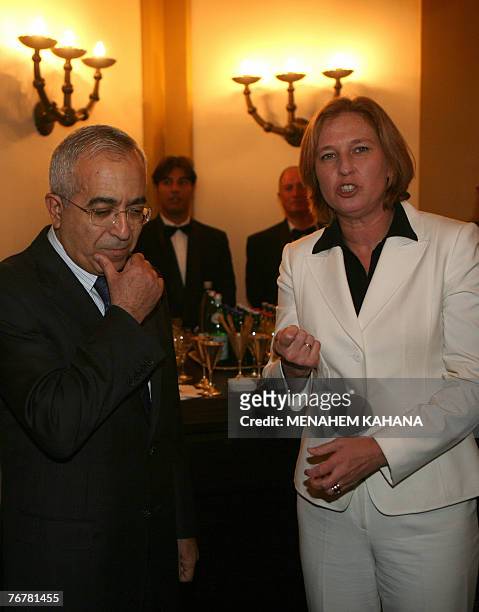 Israeli Foreign Minister Tzipi Livni talks with Palestinian Prime Minister Salam Fayyad during a Ramadan dinner or 'iftar' hosted by Livni for Muslim...