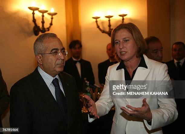 Israeli Foreign Minister Tzipi Livni talks with Palestinian Prime Minister Salam Fayyad during a Ramadan dinner or 'iftar' hosted by Livni for Muslim...