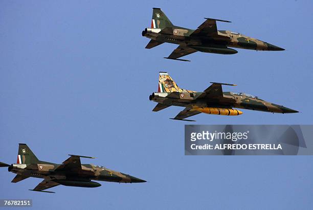 The Mexican Air Force takes part in a military parade marking the 197th anniversary of Mexico's independence at the Zocalo Square in Mexico City, 16...