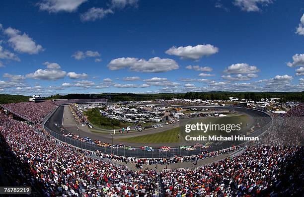 Clint Bowyer, driver of the Jack Daniel's Chevrolet, leads the field at the start of the Sylvania 300 at New Hampshire International Speedway on...