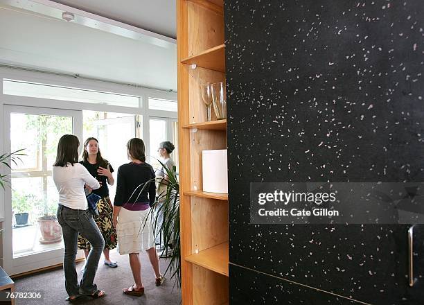 Visitors view the living area of the show home in the eco village on Helio Road in Wallington,Surrey which had its doors open to the public for...