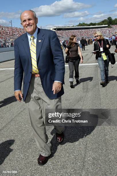 Presidential candidate Rudy Giuliani walks on pit road, prior to the Sylvania 300 at New Hampshire International Speedway on September 16, 2007 in...