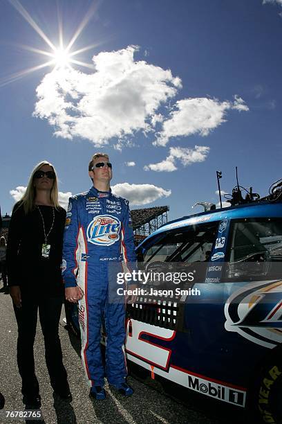 Kurt Busch, driver of the Miller Lite Dodge, stands on pit road with his wife Eva, prior to the NASCAR Nextel Cup Series Sylvania 300 at New...