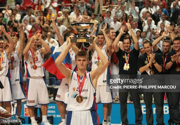 Russia's Andrei Kirilenko holds up the trophy after winning the final of the European Basketball Championships against Spain in Madrid, 16 September...