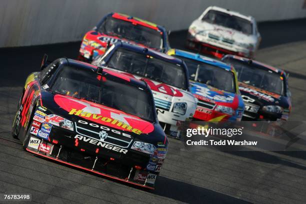 Juan Pablo Montoya, driver of the Texaco/Havoline Dodge, leads a group of cars during the NASCAR Nextel Cup Series Sylvania 300 at New Hampshire...