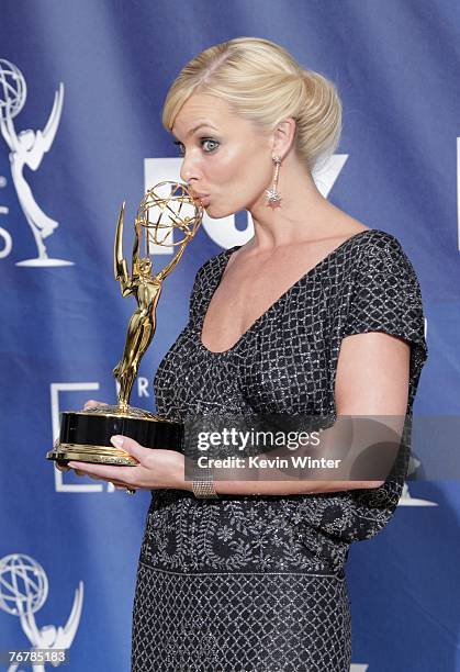 Actress Jaime Pressly poses in the pressroom with her Emmy for "Outstanding Supporting Actress in a Comedy Series" for "My Name is Earl" during the...