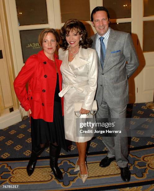Joan Collins with her husband Percy Gibson and her daughter Katy Kass attend the Julien Macdonald show during London Fashion Week on September 16,...
