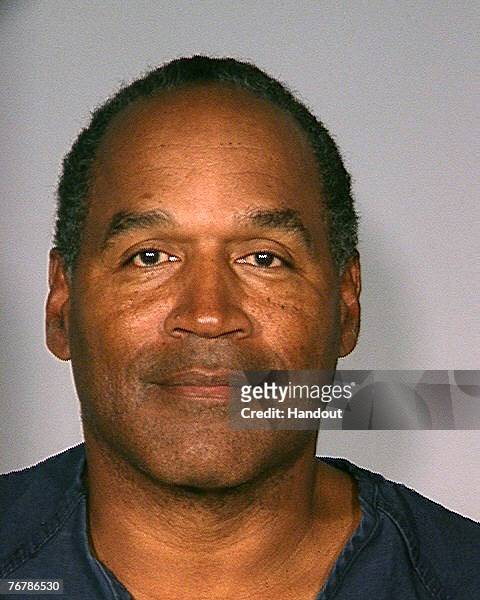 In this handout photo provided by the Las Vegas Police Department, former football player O.J. Simpson poses for a mugshot photo September 16, 2007...