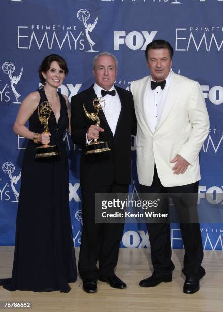 Actress Tina Fey, producer Lorne Michaels, and actor Alec Baldwin pose in the pressroom with her Emmy for "Outstanding Comedy Series" for "30 Rock"...