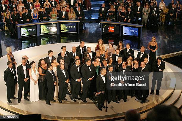 The cast and crew of "The Sopranos" accept the Outstanding Drama Series award onstage during the 59th Annual Primetime Emmy Awards at the Shrine...
