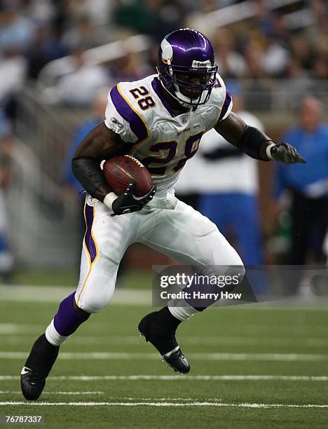 Adrian Peterson of the Minnesota Vikings runs against the Detroit Lions during the game at Ford Field on September 16, 2006 in Detroit, Michigan. The...