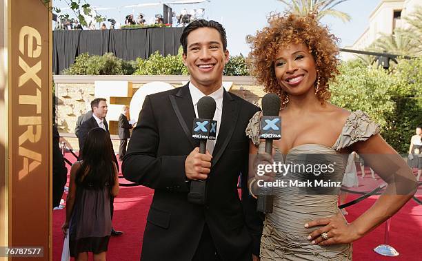 Extra's Mario Lopez and Tanika Ray chat during the 59th Annual Primetime Emmy Awards at the Shrine Auditorium September 16, 2007 in Los Angeles,...