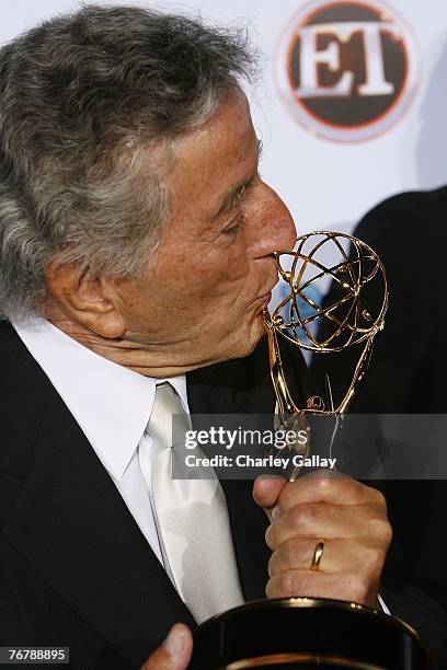 Singer Tony Bennett kisses his Emmy statuette won for "Outstanding Variety, Music Or Comedy Special" for "Tony Bennett: An American Classic" at 11th...