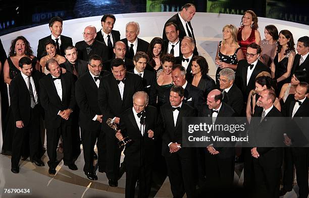The cast and crew of The Sopranos accept their Outstanding Drama Series award onstage during the 59th Annual Primetime Emmy Awards at the Shrine...