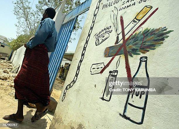 Photo taken 08 September 2007 shows a Somali man walking out of the psychiatric ward of the general hospital of the northern Somali port of Bosasso....