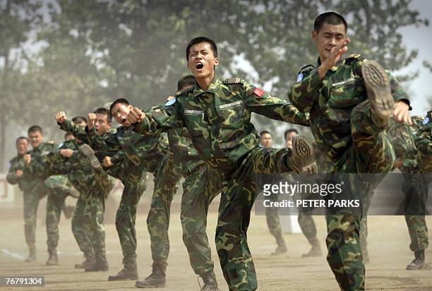 People's Liberation Army soldiers deployed for United Nations peace keeping missions show self defense skills at their base in China's central Henan...